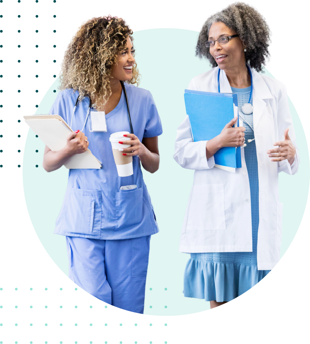 Two healthcare workers walking and talking